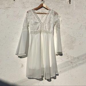 Beautiful white dress with bell sleeves and lace